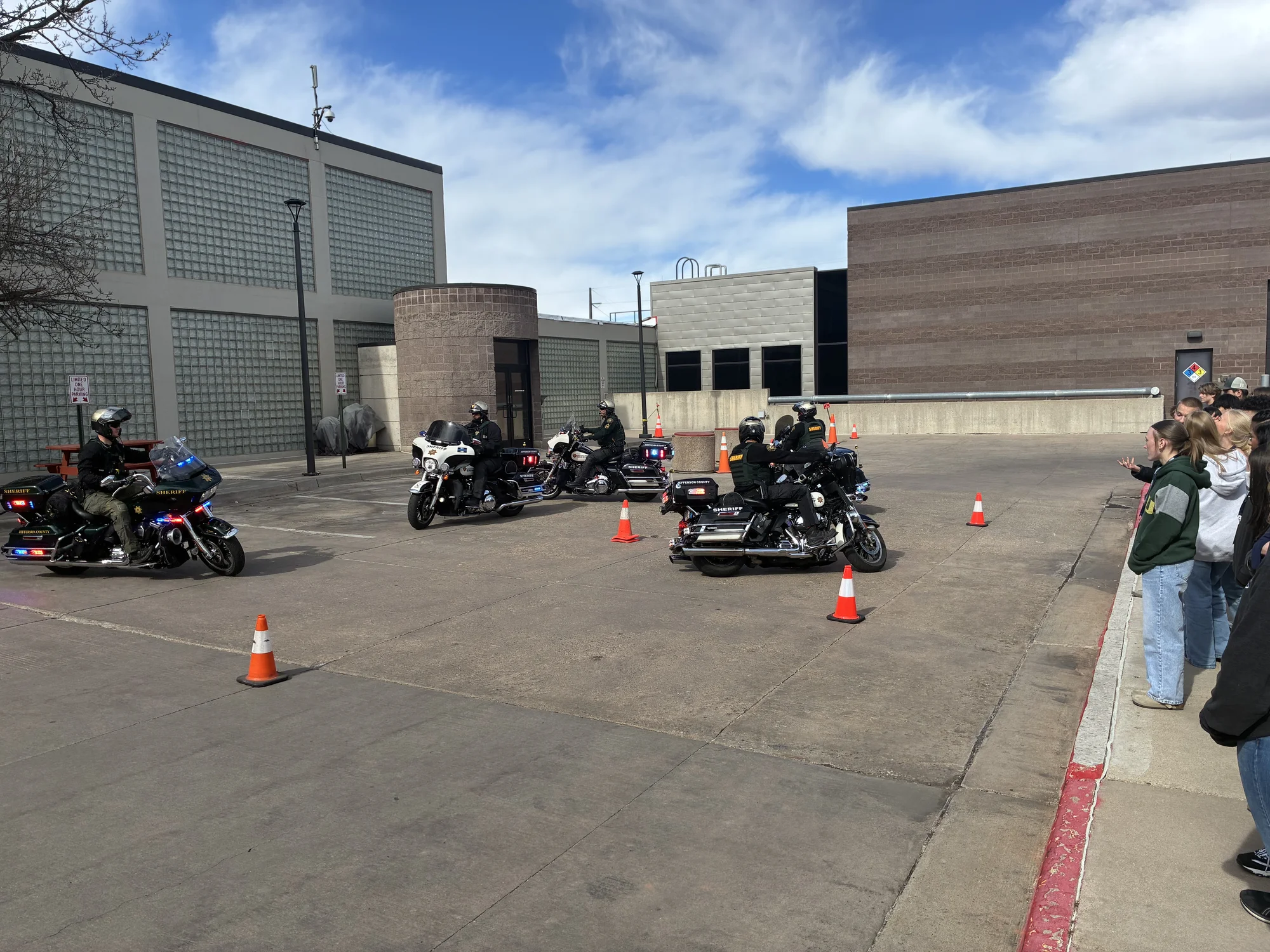 JCSO Traffic Unit showing off their fine motor skills to members of Youth Leadership Jeffco